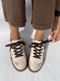 Cream suede platform sneakers with brown teddy bear embroidery and dark brown laces and sole