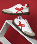 Bow sneakers for women in Red-White, lace-up design featuring ribbon applique, cushioned collar, and rounded rose toe cap.