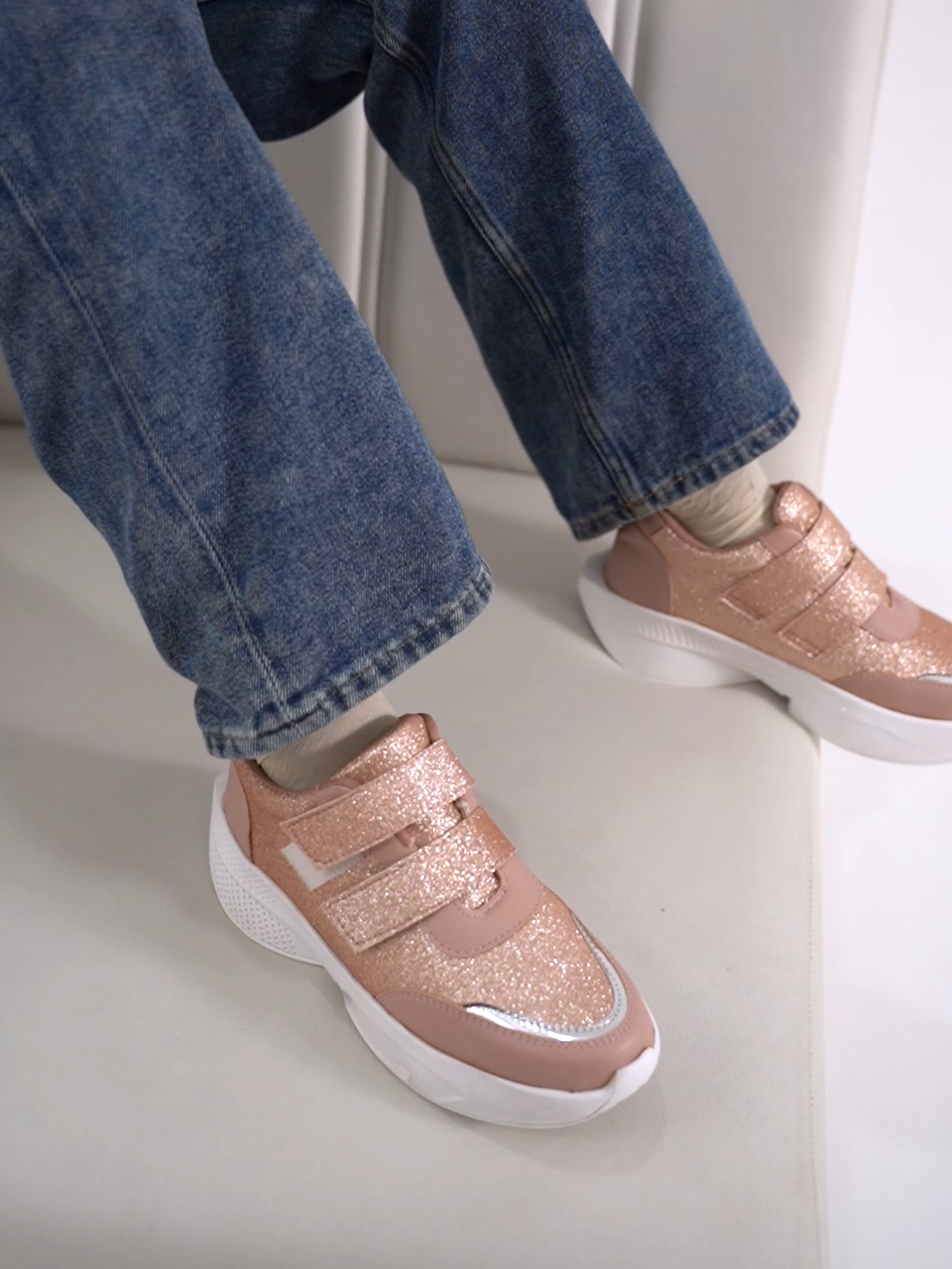 Glitter sneakers for women in Peach with dual velcro straps, white platform sole, silver toe.