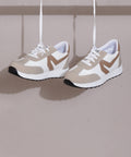 Beige-White women's sneakers in white, beige, and tan with lace-up design and chunky white sole